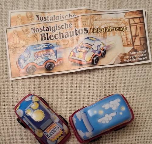 2 blechautos mit - Ü-ei,